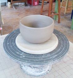 a white bowl sitting on top of a table