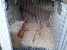 the inside of a shipping container that is filled with sand and other things in it