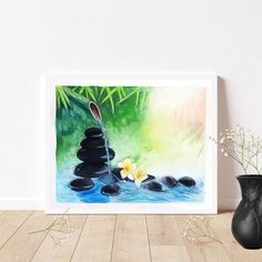 a black vase sitting on top of a wooden floor next to a painting with rocks and flowers