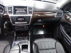 the interior of a car with black leather seats