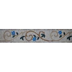 a white wall with blue flowers and leaves on it's side, in the middle of a tile border