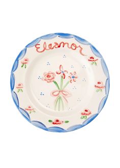 a blue and white plate with pink flowers on it that says,'mom '