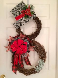 a christmas wreath hanging on the front door