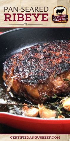 a steak is cooking in a skillet with onions and herbs on the side that says pan - seared ribeye