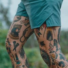 a man with tattoos on his legs and leg