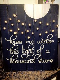 a wooden sign that says, rise me up under the light of a thousand star