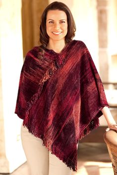 The red undertones of this poncho are inspired by the traditional costumes of San Juan de la Laguna say the women of K'amolon K'i K'ojonel who boast their pride in their classic weaving techniques. Working on a back strap loom the design of this poncho is at once classic and contemporary. A rich blend of cotton and bamboo chenille assures the soft warmth of this trendy poncho. Since the threads are dyed by the women please expect slight differences in the color tone and arrangement. Traditional Red One-size Poncho, Traditional Red Poncho For Fall, Traditional Red Fall Poncho, Traditional Red Shawl Poncho, Red One-size Poncho Cape, Red One-size Cape Poncho, Red One Size Cape Poncho, Crochet Cape, Hairpin Lace