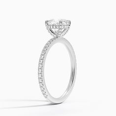 a diamond engagement ring on a white background