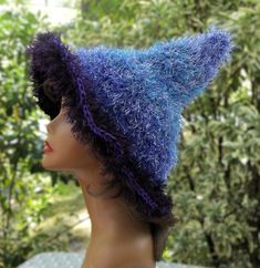 One of a kind purple fuzzy witch hat.  An awesome accessory for your next holiday party, to wear to your favorite festival or cosplay event, or to wear just because your feeling a little witchy.  Great for men or women or to give as a gift. Created with dark purple acrylic yarn and several shades of purple eyelash yarn. Hand wash gently with a mild detergent and lay flat to dry. 16" brim to tip fits most adults or teens Purple Hats For Halloween Costume Party, Purple Halloween Costume Hat, Adjustable Purple Hat For Costume, Purple Whimsical Costume Hat, Blue Adjustable Costume Hat For Cosplay, Whimsical Purple Costume Hats For Halloween, Adjustable Purple Halloween Hat, Whimsical Purple Halloween Costume Hats And Headpieces, Whimsical Purple Halloween Costume Hat