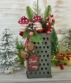 a metal grater with christmas decorations on it