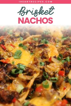 a close up of a plate of nachos with meat and cheese on it