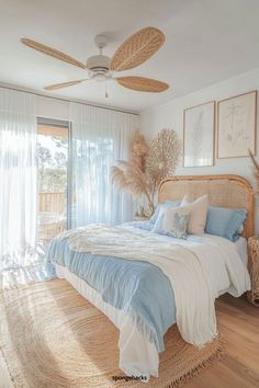 a bedroom with a bed, wicker headboard and ceiling fan