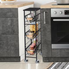 a kitchen with an oven, microwave and various food items on the rack in front of it