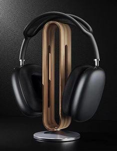 an image of headphones on display in front of a black background with gold accents