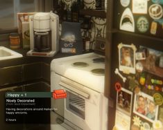 an image of a kitchen scene with focus on the oven and refrigerator door, which is decorated with stickers