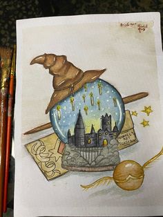 a drawing of a wizard's hat on top of a snow globe with hogwarts castle in it