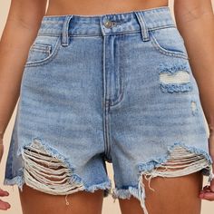 Unleash your inner fashionista with these High Rise Distressed Denim Shorts! These shorts are perfect for adding a touch of edginess to any outfit. Grab a pair now and embrace your unique style! HIGH RISE - DESTRUCTION ON HEMLINE - RELAXED FIT - NON STRETCH - INSEAM: 3" WITH FRAYED Trendy Distressed Short Bottoms, Trendy Distressed Short Leg Shorts, Distressed Denim Blue High-waisted Shorts, Trendy Distressed Mid-rise Shorts, Trendy Mid-rise Distressed Shorts, Trendy Distressed Short Leg Bottoms, Ripped High-waisted Denim Shorts, Trendy Distressed Medium Wash Shorts, Trendy Denim Blue Cutoff Shorts