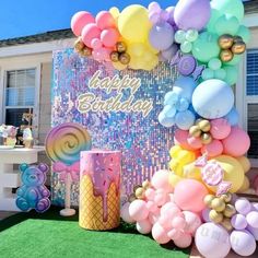 an outdoor birthday party with balloons and decorations