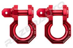 pair of red metal shacks with two hooks on each side and one is holding an object