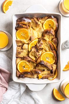 a white dish filled with bread and orange slices