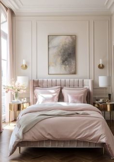 a bed with pink sheets and pillows in a bedroom next to a painting on the wall