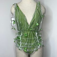 Nwt Size L. Color Is Green With A Mesh Cover Embellished With Butterflies. Pull On Style, Removable Inserts. Approximate Measurements: Armpit-17 1/2”, Waist-13”, Length-27”. J33-4034 Green One-piece Bodysuit For Party, Green One-piece Party Bodysuit, Green Sleeveless Bodysuit For Party, Black Halter Bodysuit, Criss Cross Halter Top, Brown Bodysuit, Corset Bodysuit, High Neck Bodysuit, Fairy Style