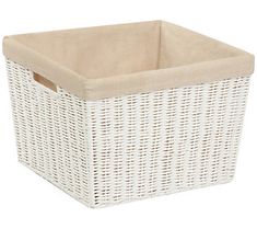 a white wicker basket with a tan lining