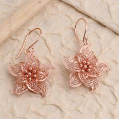 You'll want to go star gazing tonight in this pair of delicate dangle earrings from Bali's Yuniati. Designed from 18k rose gold plated sterling silver these star-shaped flower earrings feature pointed petals crafted with ornamental filigree work. Rose Gold Dangle Jewelry For Mother's Day, Hypoallergenic Rose Gold Jewelry Gift For Her, Elegant Rose Gold Flower Earrings For Gift, Hypoallergenic Rose Gold Earrings For Gift, Nickel-free Rose Gold Dangle Jewelry, Rose Gold Flower-shaped Jewelry With Matching Earrings, Rose Gold Sterling Silver Filigree Jewelry, Rose Gold Drop Earrings For Mother's Day, Rose Gold Jewelry With Matching Earrings For Mother's Day