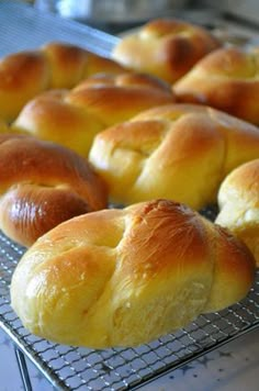 bread rolls cooling on a rack in a bakery