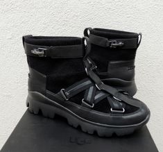 UGG PUFF MOMMA LAKES AND LIGHTS SNEAKER ANKLE BOOTS  ~ NEW IN BOX ~ FROM THE FASHION BABY COLLECTION WOMEN'S US 7.5/ EUR 38.5/ UK 5.5 STYLE# 1098665 COLOR: BLACK PLEASE READ: PAIR HAS THE NEW 2019 HOLOGRAM LABEL ON THE LEFT SHOE . THE 2019 VERSION NO LONGER HAS THE QR FEATURE Rib knit collar with a ski inspired buckle Leather lower and trim Textile lined upper, Leather lined lower  UGG pure sheepwool insole Chunky treadlite by UGG outsole  Inside size tag and one of the box upc's have been marked to prevent retail store returns Please note, most UGG's are now made in China or Vietnam. NONE are made in Australia. IF IN DOUBT, CONTACT UGG PLEASE SEE THE PICTURES FOR MORE DETAIL. I BUY ALL MY UGGS FROM THE UGG PARENT COMPANY DECKERS. YES, DECKERS OUTDOOR CORP. OWNS UGG! I HAVE SOLD OVER 20000 Lights Winter, Athletic Models, Light Sneakers, Winter Sneakers, Fashion Baby, Ugg Australia, Knit Collar, Winter Boot, Size Tag