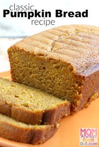 two slices of pumpkin bread sitting on top of an orange plate with the words classic pumpkin bread recipe