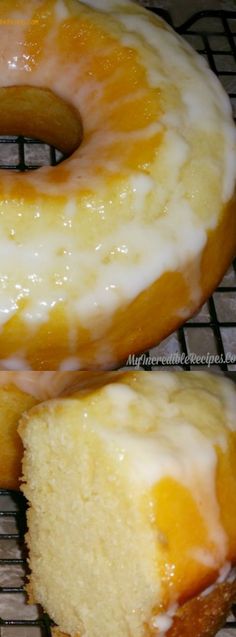 two glazed doughnuts sitting on top of a cooling rack next to each other