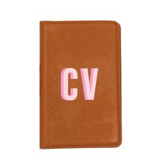 a brown wallet with pink lettering on the front and bottom, which reads cvv