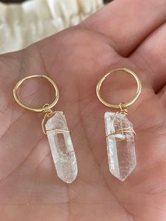 "These raw crystal quartz huggies are the sweetest little hoops of your dreams. Wear in your second hole or first, you choose! They're lightweight and beautiful as a single earring or layered with other earrings. The crystal moves freely on the ring and no two crystals are alike! QUARTZ GEMSTONE PROPERTIES Quartz is the power stone that invites you to step into your power in every moment. It amplifies energy and intention. ▲ Choose 14k gold fill or sterling silver hoops ▲ Raw crystal quartz *all Clear Hoop Earrings For Pierced Ears As Gift, Clear Small Hoop Earrings As Gift, Nickel-free Hoop Crystal Earrings As Gift, Clear Hoop Jewelry As A Gift, Clear Small Hoop Earrings Gift, Clear Hoop Jewelry For Gifts, Clear Hoop Jewelry For Gift, Clear Small Hoop Jewelry For Gifts, Clear Small Hoop Jewelry Gift