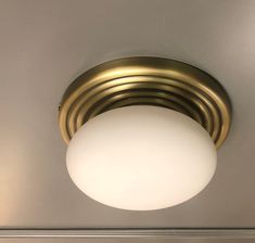 a close up of a light fixture on a ceiling