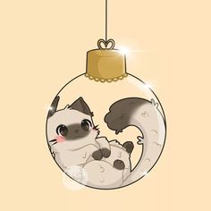 a christmas ornament with a cat hanging from it's side