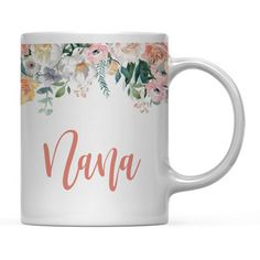 a white coffee mug with the word ava on it and flowers in front of it