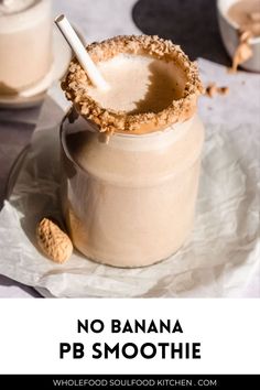 no banana pb smoothie in a jar with a spoon and peanuts on the side