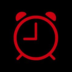 a red alarm clock on a black background