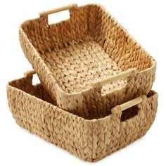 two wicker baskets with handles on white background