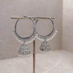 Crystal and white pearl design light weight silver Hoop earrings 2 inch length x 1 inch wide jhumka bell. Ready to ship as seen with gift box. Silver Hoop Earrings With Latkans For Diwali, White Dangle Chandbalis, Silver Metal Hoop Earrings For Celebrations, Festival Silver Hoop Earrings With Latkans, Festive Silver Hoop Earrings With Latkans, Silver Hoop Earrings With Latkans For Festivals, White Hoop Earrings With Latkans For Celebration, White Hoop Earrings With Latkans For Festive Occasions, Silver Hoop Earrings For Festive Celebrations