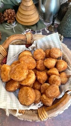 a basket filled with donuts sitting on top of a table