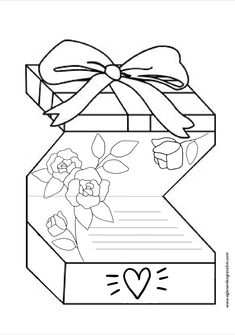 a gift box with a bow and flowers on the top is shown in black and white