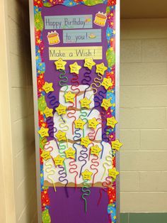 a door decorated with birthday decorations and writing on the front is purple, white, and yellow