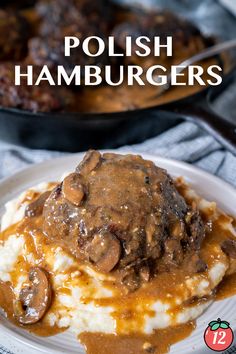 a plate with mashed potatoes covered in gravy and mushrooms