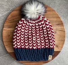 Keep warm and show off your USA Pride with this fun beanie!  Made with a 80% Acrylic/ 20% Wool Blend yarn, and topped with a fun faux fur beanie.  Adult size fits most women, but can be made larger if needed! Made using the River Bend Beanie pattern by Aspen Leaf:  https://www.etsy.com/listing/719970351/knitting-pattern-the-riverbend-beanie-in?ga_order=most_relevant&ga_search_type=all&ga_view_type=gallery&ga_search_query=aspen+leaf&ref=sr_gallery-1-12&sts=1&dd=1&content_source=ee591d3a18f7438b02 Beanie Pom Pom, Aspen Leaf, Usa Pride, Beanie Pattern, Women's Beanie, Pom Pom Hat, Skull Cap Beanie, Knit Beanie, Red White And Blue