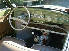 the interior of an old car is clean and ready to be used as a shopping cart