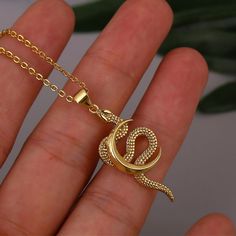 This snake jewelry piece showcases a delicate and dainty design. The snake symbolizes transformation, rebirth, and wisdom, while the moon represents feminine energy, intuition, and cycles of life! Our necklace serves as a unique expression of style and personality. It's an exquisite piece that effortlessly complements any outfit, adding a touch of mythological allure to your look. It also makes a thoughtful gift for that special someone in your life. ✨ ✦ NECKLACE DETAILS: * Pendant Size: 3.7 Centimeters // 1.5 Inches * Chain Length: Adjustable 45-50 Centimeters // 17-19 Inches * All our work is custom-made by hand with love 💖 ✦ FREE SHIPPING + 15% OFF (4-9 Days) --- Do you love this item and want to buy it later? Just click on the heart-shaped icon to your right to add it to your favorite Medusa Necklace, Medusa Pendant, Animal Zodiac, Snake Jewelry, Snake Necklace, Zodiac Pendant, Jewelry Lookbook, Necklace Dainty, Fantasy Jewelry