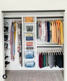 an organized closet with clothes and shoes