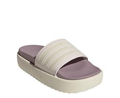 adidas Adilette Platform Womens Slide Sandal Step up your Slide look in the adidas Adilette Platform women s Slide Sandal. With a faux leather upper featuring the 3-Stripes for extra style, this Slide is cool and comfy. The contoured footbed cradles and cushions your foot, while the platform keeps you lifted. Synthetic upper Slip-On Textile liningContoured footbedEVA platform/outsole Adidas Slides For Sports In Spring, Adidas Logo Slides For Sports In Spring, Spring Adidas Slides For Sports, Synthetic Sport Sandals For Spring, Adidas Synthetic Sport Sandals With Cushioned Footbed, Adidas Synthetic Sport Sandals For Spring, Adidas Sport Sandals For Spring Sports, Adidas Sporty Sport Sandals For Spring, Synthetic Slides For Sports In Spring